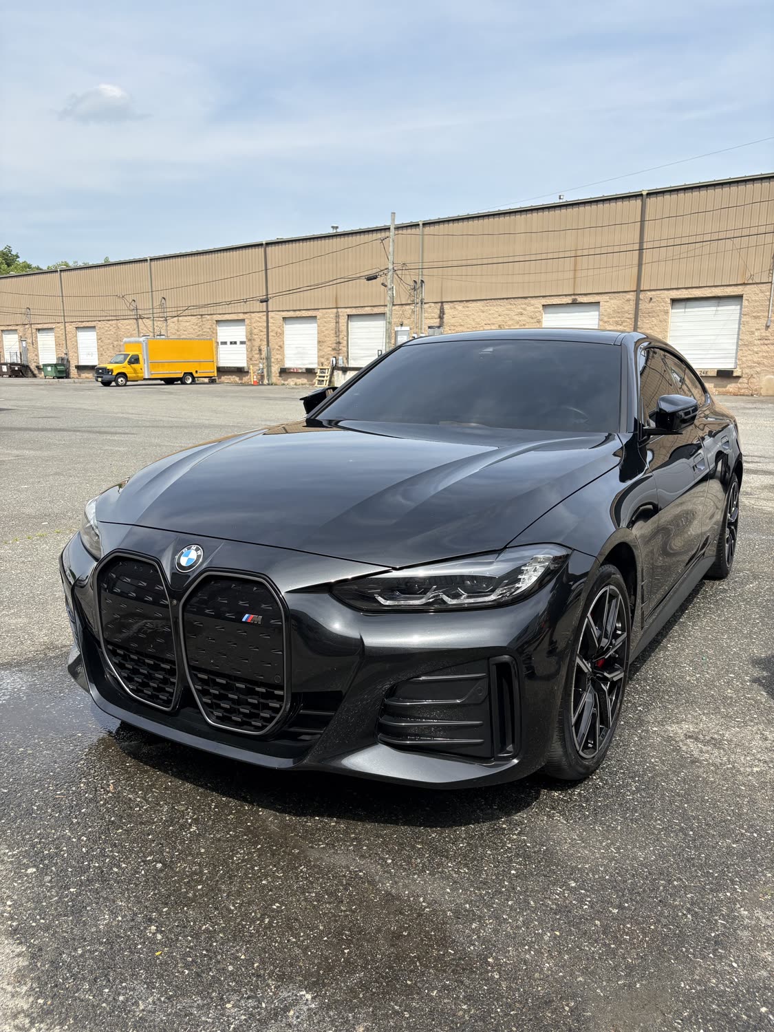 Glossy black BMW i4 after a full exterior detail